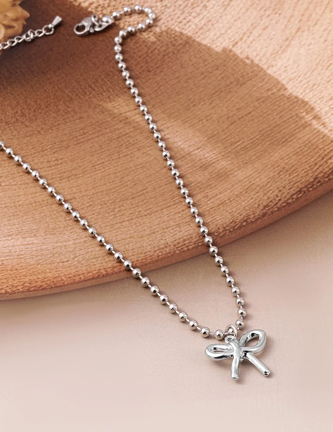 Rhodium Plated Silver Beaded Chain Necklace with Minimalist Bow Pendant